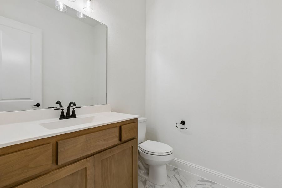 Representative furnished interior of a home built from the Pecos by Sandlin Homes in Settler's Glen, New Fairview (Image 14).
