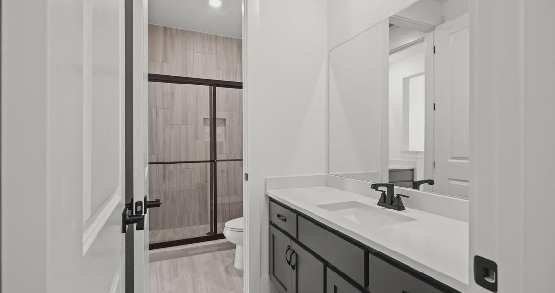 Representative furnished interior of a home built from the Allison by Chesmar Homes in Sweetwater, Austin (Image 11).