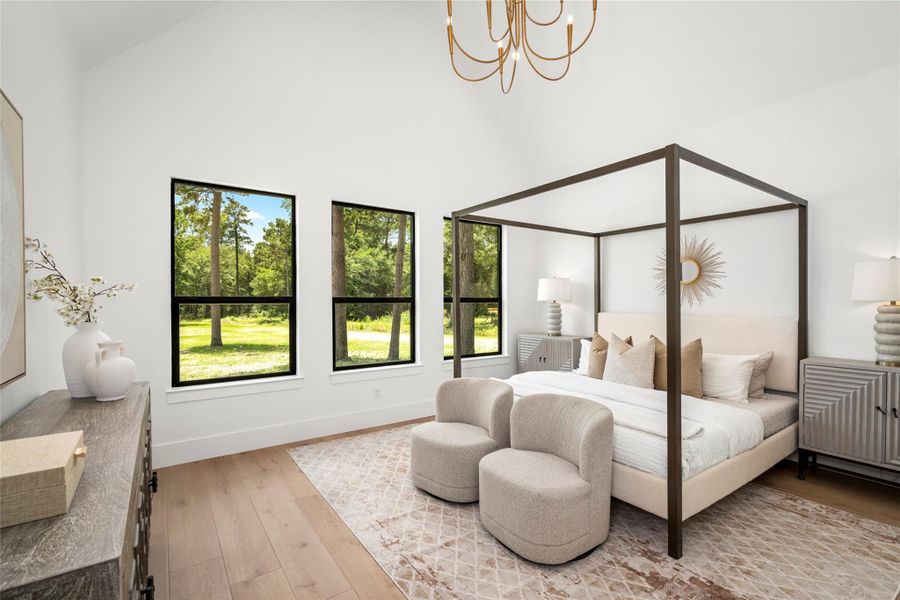 Primary bedroom suite with vaulted ceilings, exposed beam detail, oversized windows, and serene backyard views. Primary bedroom suite with vaulted ceilings, exposed beam detail, oversized windows, and serene backyard views.