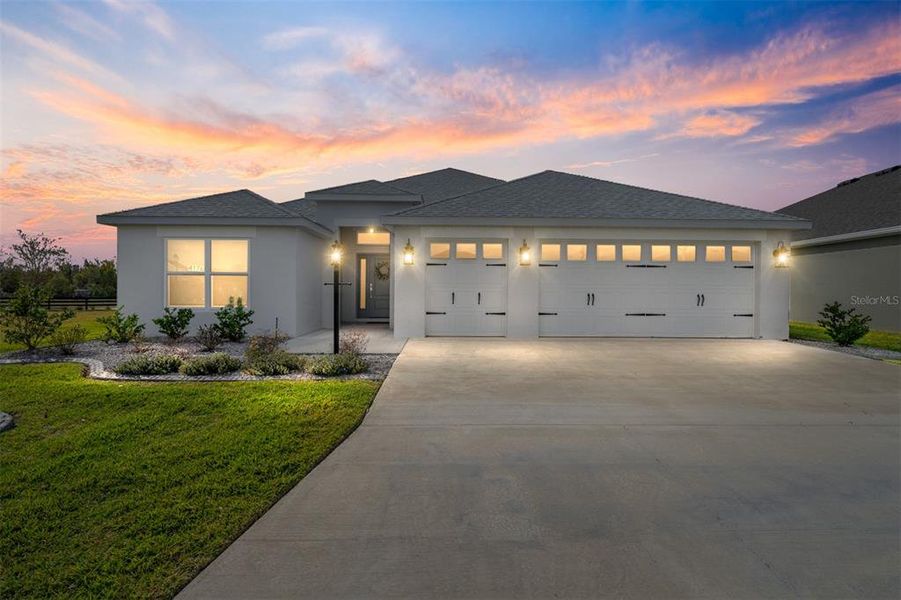Front exterior of a new home in , The Villages, FL, highlighting curb appeal (Image 1).