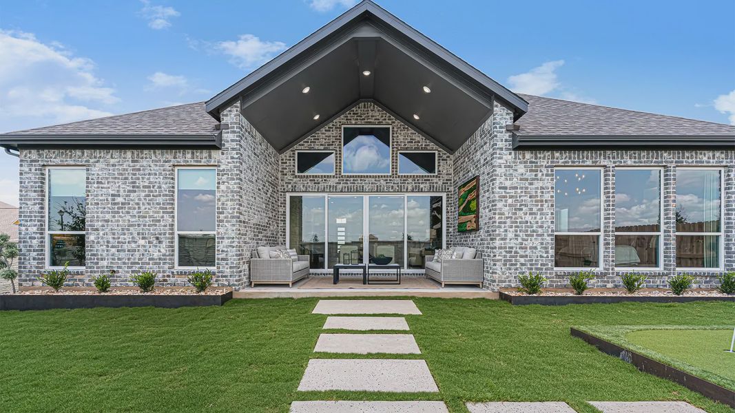 Representative exterior photo of a completed home built from the Silas by Chesmar Homes in Crescent Bluff, Georgetown, TX (Image 22).