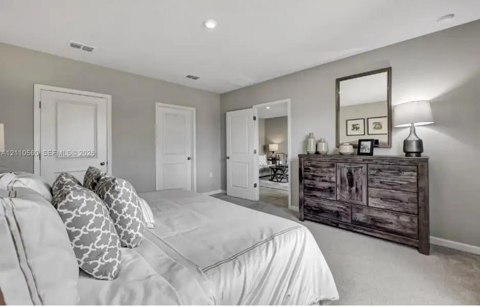 Neutral-toned interior featuring recessed lighting, carpeted flooring, and multi-panel interior doors