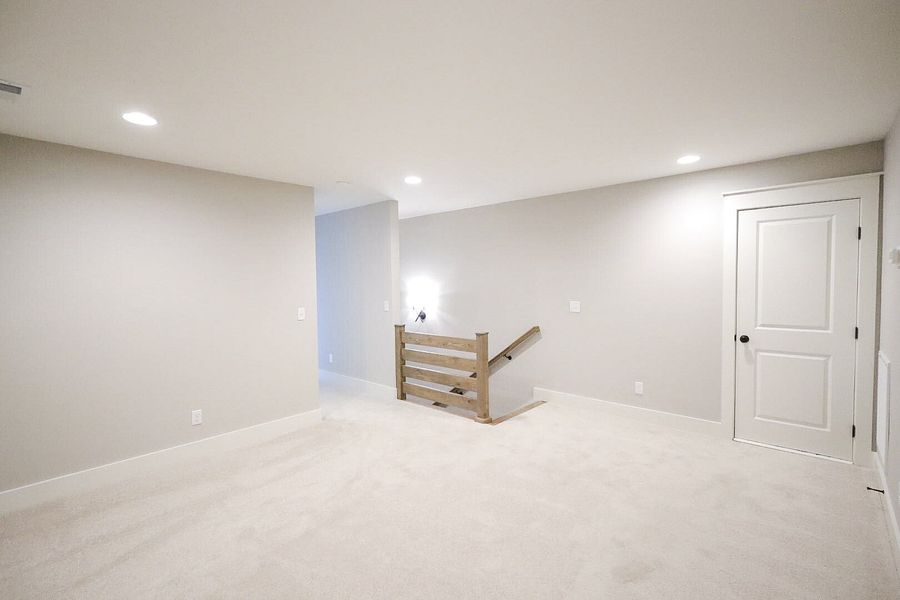 Spacious, unfurnished interior of a new home in Baker Road, Birchwood (Image 49).