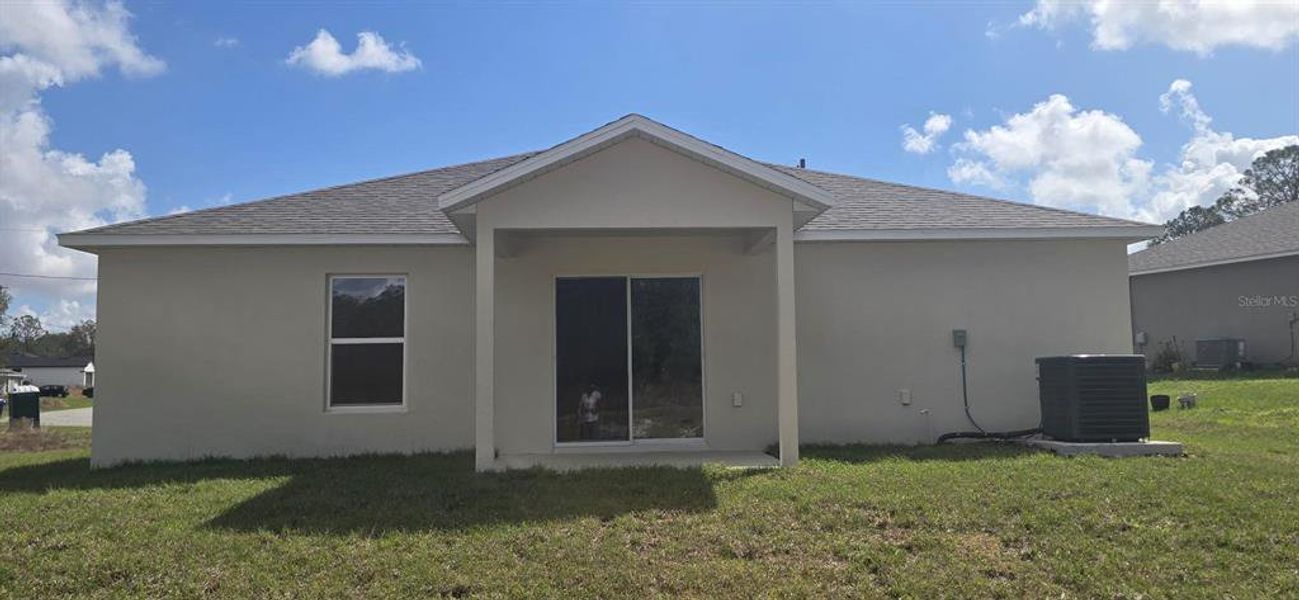 Exterior details and patio area of a home in Poinciana, Poinciana (Image 11).