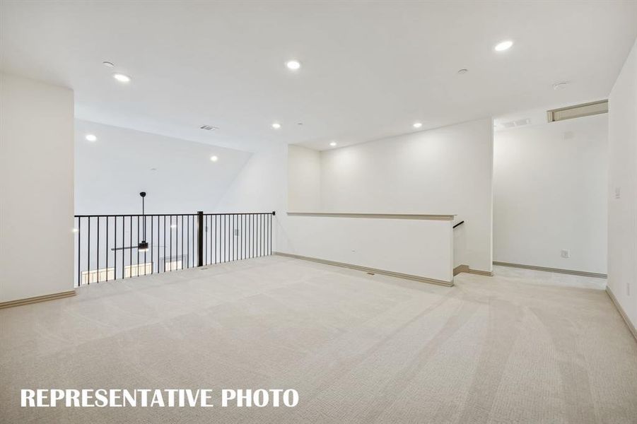 The spacious game room is the perfect place to host those big game day parties!  REPRESENTATIVE PHOTO