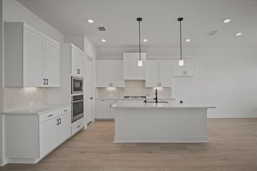Representative furnished interior of a home built from the Farris by Chesmar Homes in Gregg Ranch, Marble Falls (Image 6).