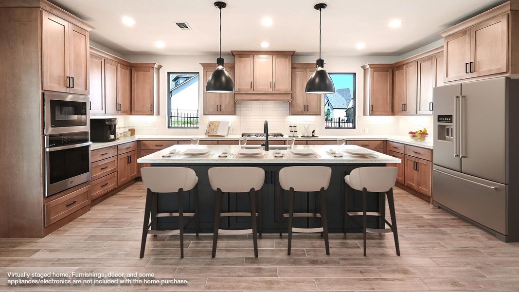 Kitchen featuring stainless steel appliances, a kitchen breakfast bar, a kitchen island with sink, decorative light fixtures, and tasteful backsplash Kitchen featuring stainless steel appliances, a kitchen breakfast bar, a kitchen island with sink, decorative light fixtures, and tasteful backsplash