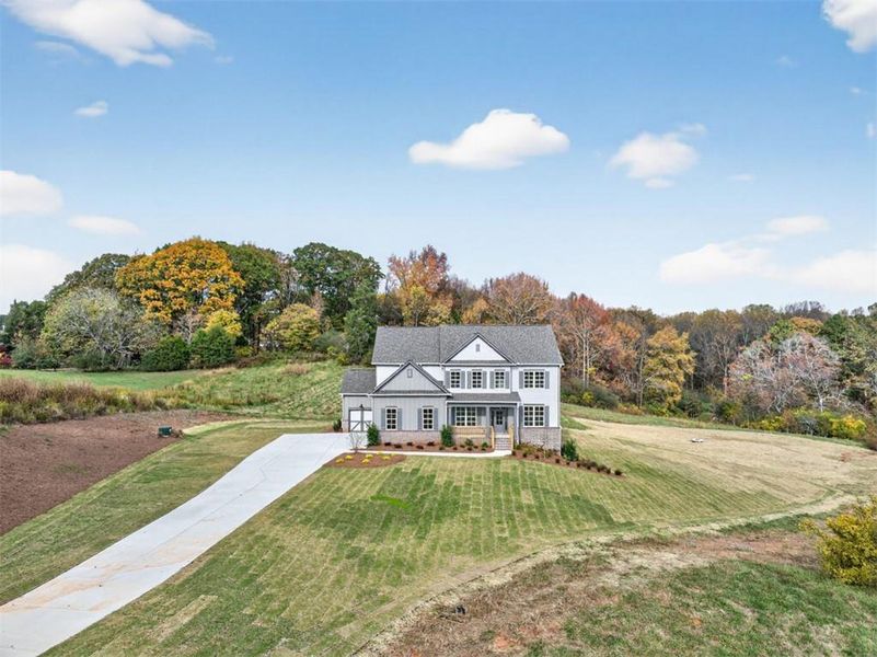 Front exterior of a new home in , Gainesville, GA, highlighting curb appeal (Image 29). Front exterior of a new home in , Gainesville, GA, highlighting curb appeal (Image 29).