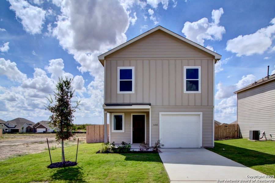 Front exterior of a new home in Prairie Green, Converse, TX, highlighting curb appeal (Image 1). Front exterior of a new home in Prairie Green, Converse, TX, highlighting curb appeal (Image 1).