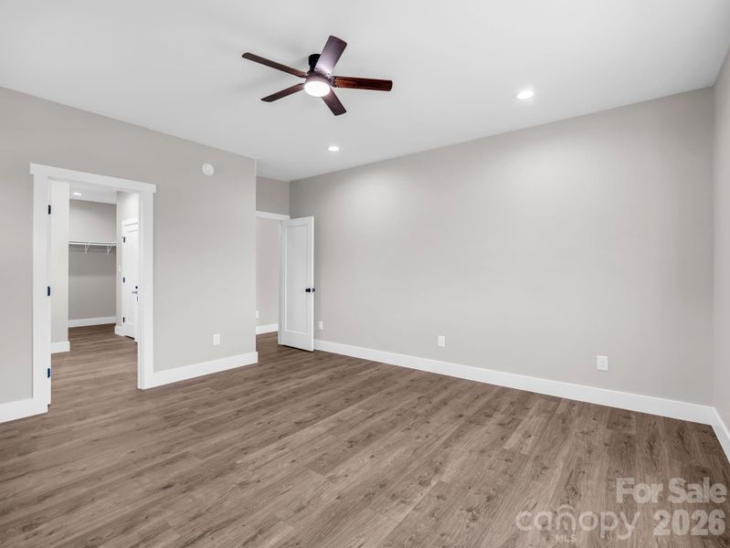Primary bedroom, abundant natural light, hardwood floors Primary bedroom, abundant natural light, hardwood floors