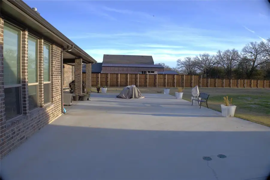 New Addition - Fenced backyard featuring a patio