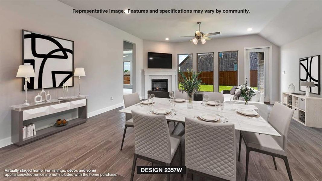 Dining space featuring dark wood-type flooring, ceiling fan, and vaulted ceiling