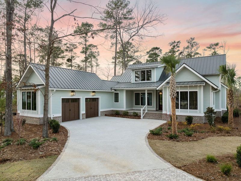 Front exterior of a new home in , Ravenel, SC, highlighting curb appeal (Image 27).