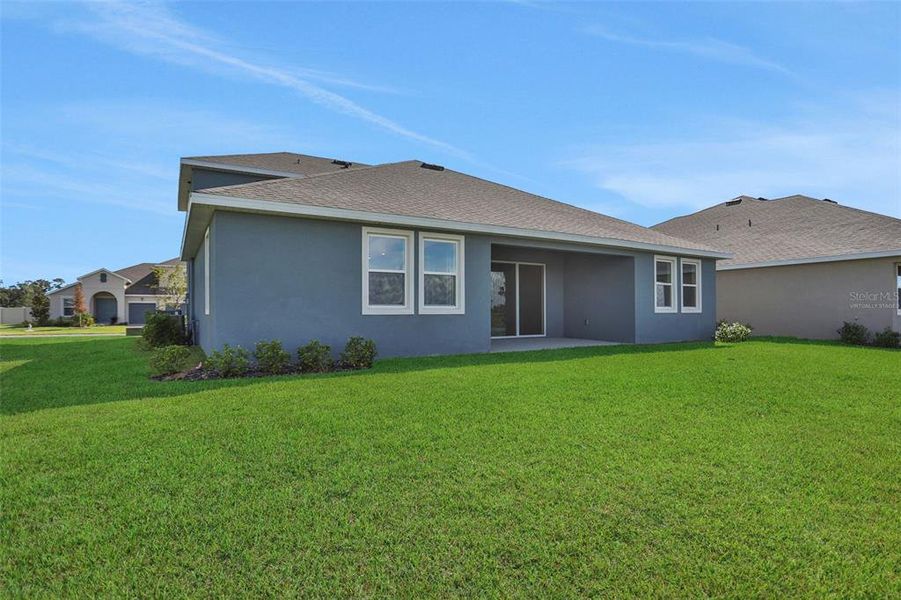 Exterior details and patio area of a home in Seaire, Parrish (Image 18).