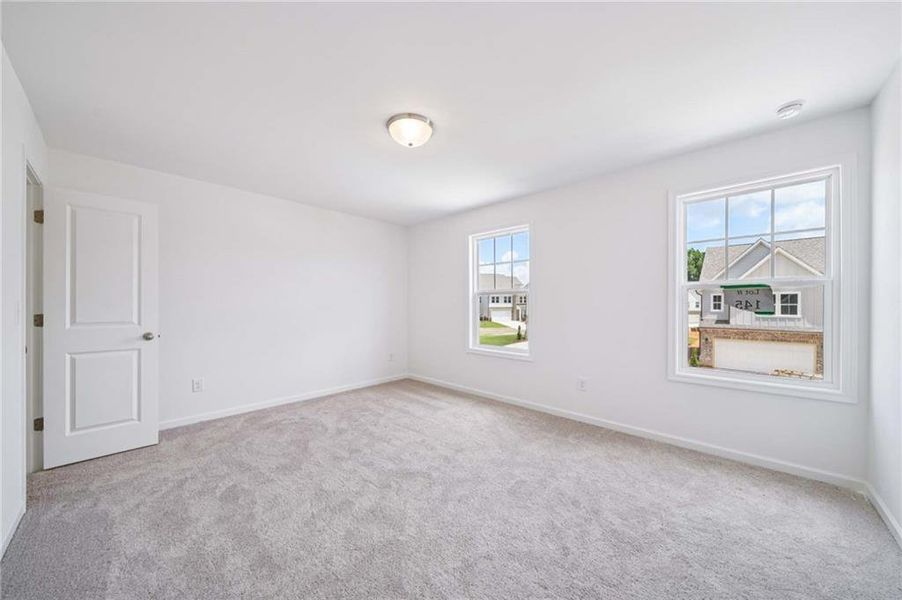Spacious, unfurnished interior of a new home in Eastlyn Crossing, Flowery Branch (Image 16).