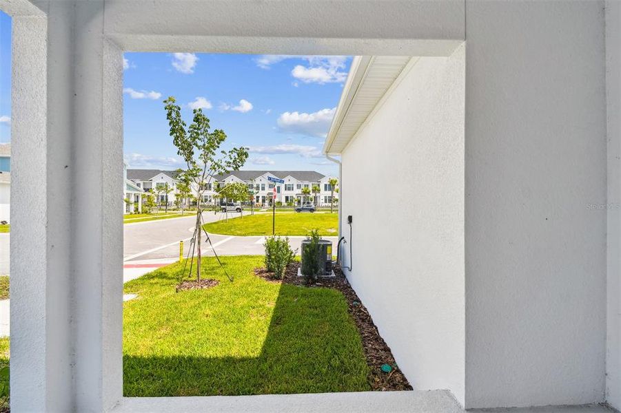 Exterior details and patio area of a home in Emerald Landing at Waterside at Lakewood Ranch – Cottage Series, Sarasota (Image 3).