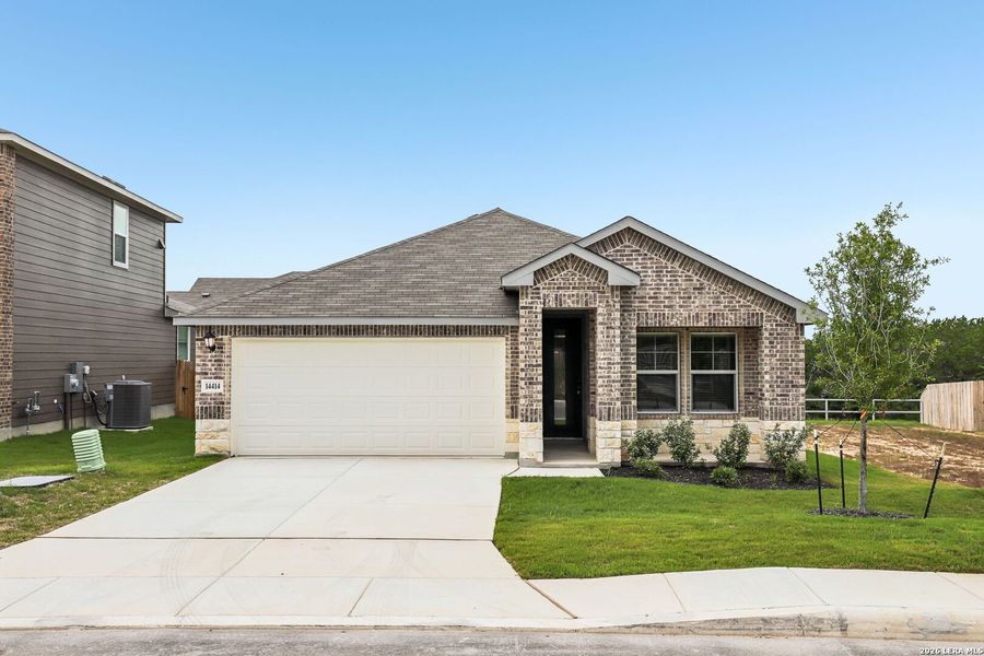 Front exterior of a new home in Thomas Pond, San Antonio, TX, highlighting curb appeal (Image 1). Front exterior of a new home in Thomas Pond, San Antonio, TX, highlighting curb appeal (Image 1).