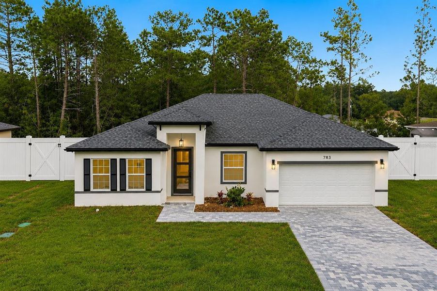 Front exterior of a new home in , Ocala, FL, highlighting curb appeal (Image 2). Front exterior of a new home in , Ocala, FL, highlighting curb appeal (Image 2).