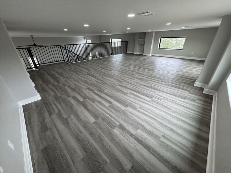 Upstairs Family room / Flex SpaceAI Generated flooring, vinyl plank in process of being installed.