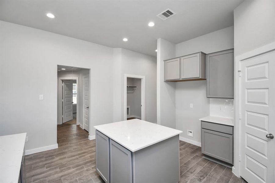 Another view of the spacious kitchen. Representation of completed home with similar plan. Actual color and selections will vary.