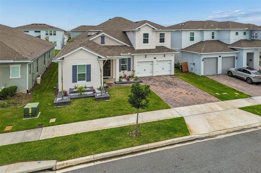 Front exterior of a new home in , Orlando, FL, highlighting curb appeal (Image 33).