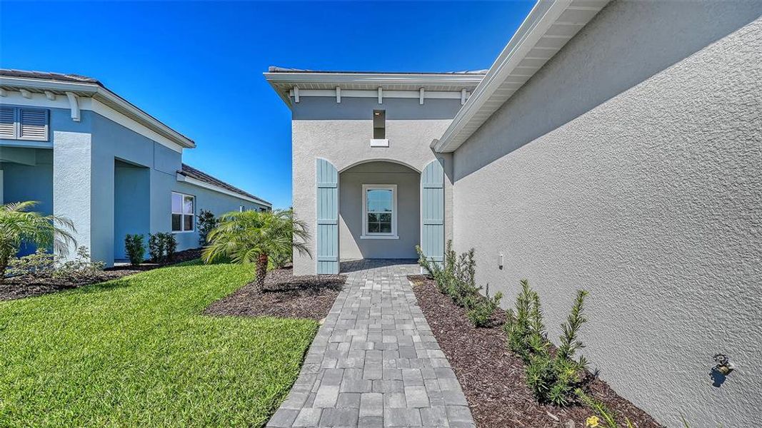 Exterior details and patio area of a home in Palm Grove, Lakewood Ranch (Image 30).