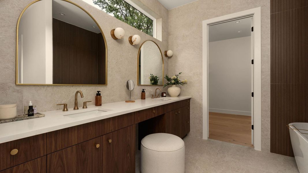 Indulge in a primary bathroom featuring a spacious double vanity with dual sinks and elegant accents. Indulge in a primary bathroom featuring a spacious double vanity with dual sinks and elegant accents.