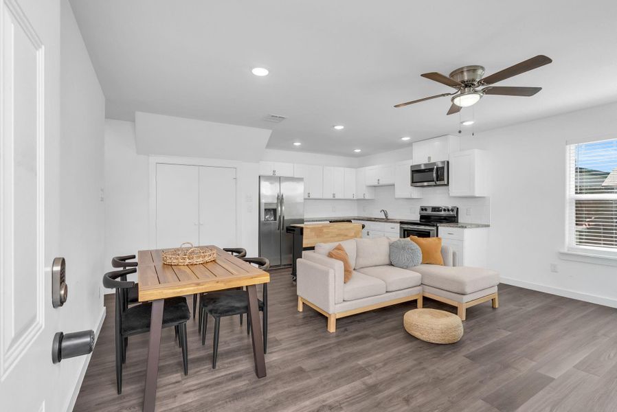 Each unit has 3 bedrooms and 3 full bathrooms. Step inside unit B which opens to a bright, open-concept living space with modern finishes. Note the ceiling fan and large window adding comfort and natural light. Each unit has 3 bedrooms and 3 full bathrooms. Step inside unit B which opens to a bright, open-concept living space with modern finishes. Note the ceiling fan and large window adding comfort and natural light.