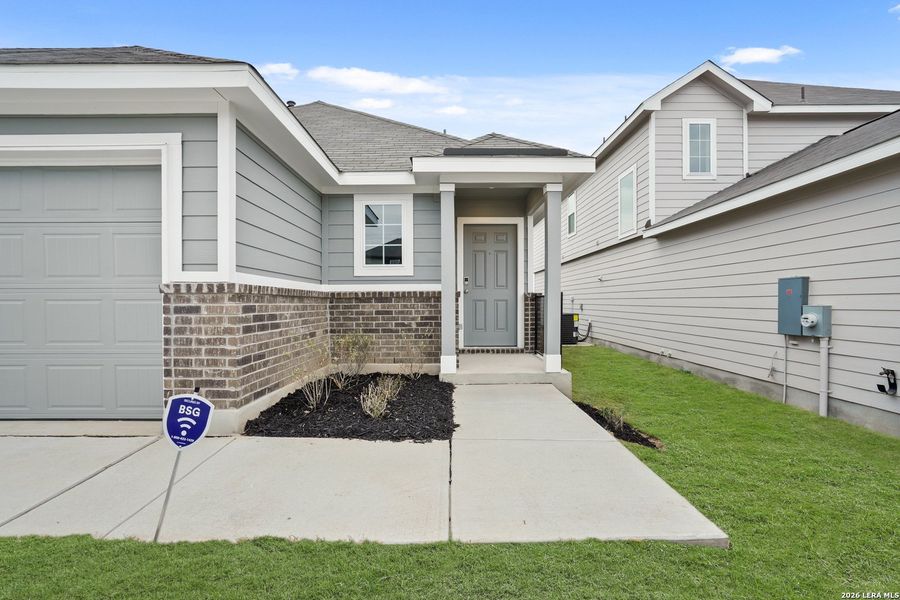 Exterior details and patio area of a home in Hickory Ridge, Elmendorf (Image 3).