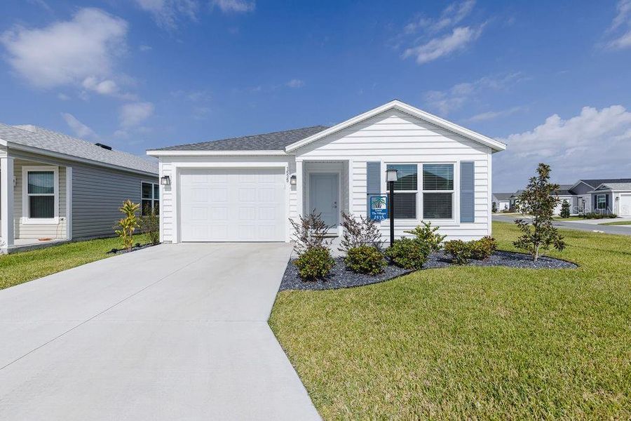 Front exterior of a new home in , The Villages, FL, highlighting curb appeal (Image 28).