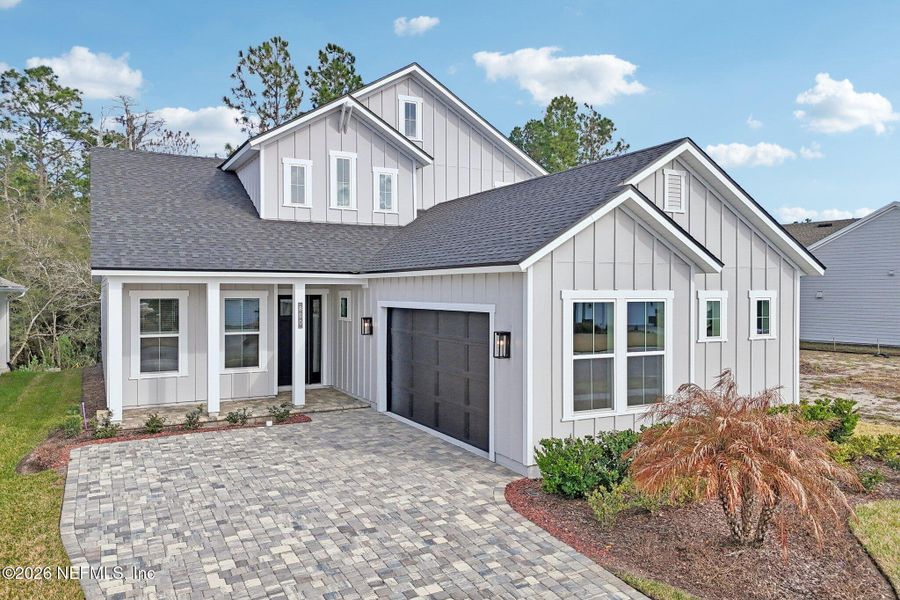 Front exterior of a new home in Middlebourne, St. Johns, FL, highlighting curb appeal (Image 29). Front exterior of a new home in Middlebourne, St. Johns, FL, highlighting curb appeal (Image 29).