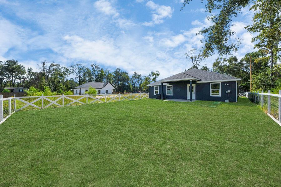 Exterior details and patio area of a home in , Splendora (Image 16).