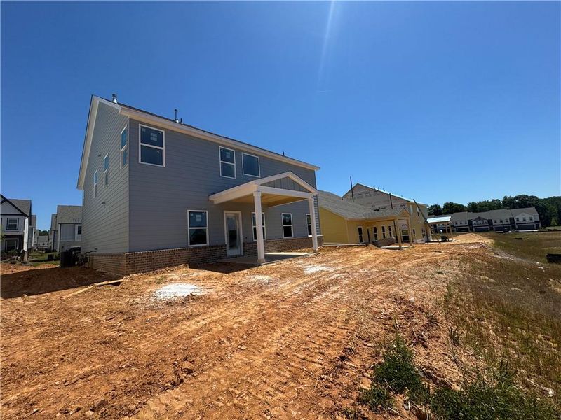 Exterior details and patio area of a home in Eastlyn Crossing, Flowery Branch (Image 3).