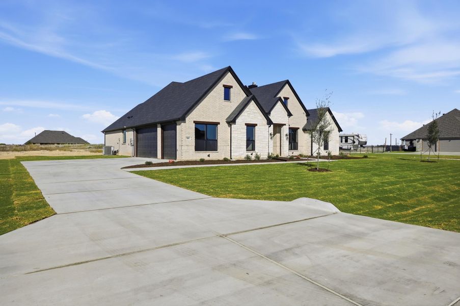 Front exterior of a new home in Rocky Top Ranch, Azle, TX, highlighting curb appeal (Image 21). Front exterior of a new home in Rocky Top Ranch, Azle, TX, highlighting curb appeal (Image 21).