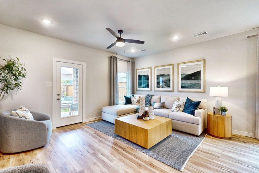 A living room with a couch and a table.