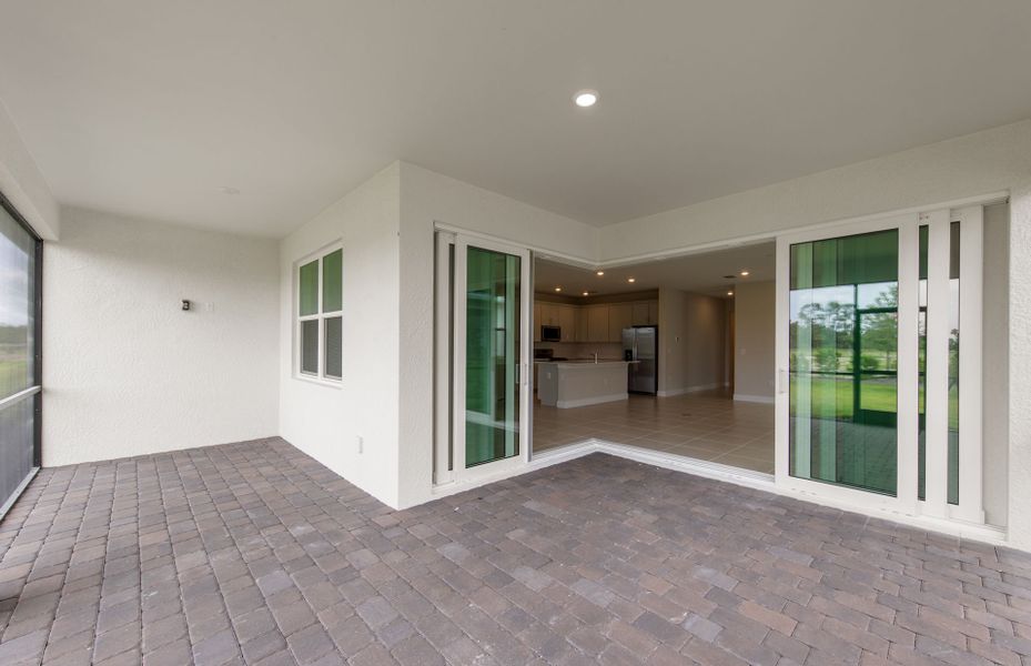 Exterior details and patio area of a home in Del Webb Oak Creek, North Fort Myers (Image 2).