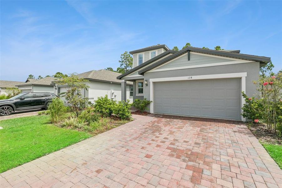 Front exterior of a new home in , Daytona Beach, FL, highlighting curb appeal (Image 26).
