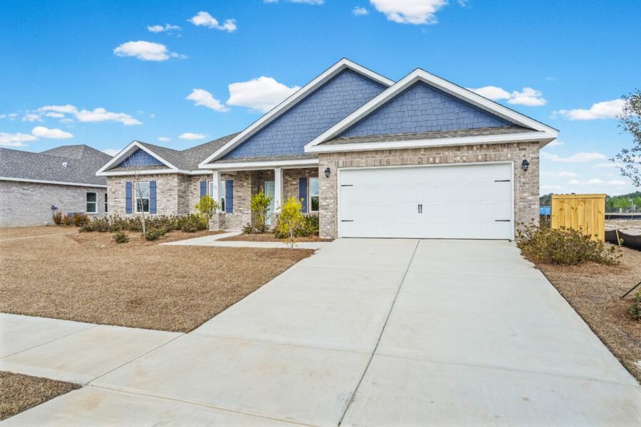 Front exterior of a new home in Natureview, Freeport, FL, highlighting curb appeal (Image 19).
