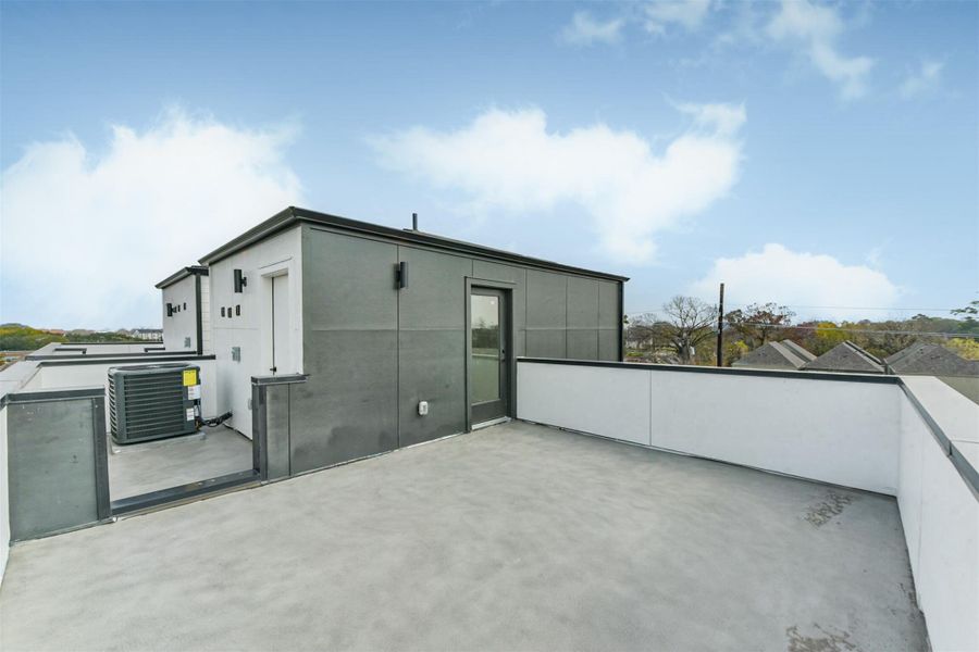 Continue up to the fourth floor to the rooftop deck. Great opportunity for an entertainment space or a place to relax and enjoy the sun.