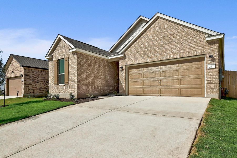 Front exterior of a new home in Centerpoint Meadows, Lockhart, TX, highlighting curb appeal (Image 2). Front exterior of a new home in Centerpoint Meadows, Lockhart, TX, highlighting curb appeal (Image 2).
