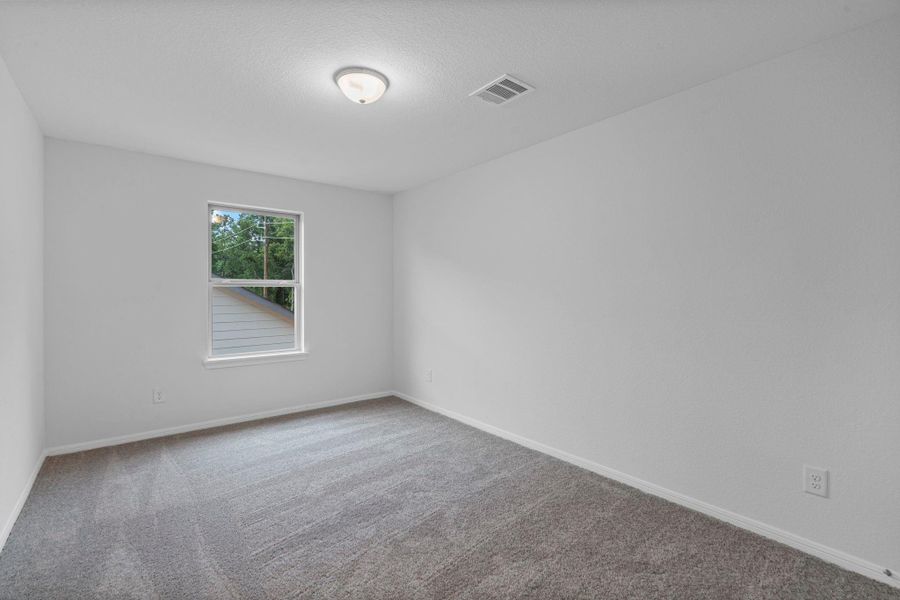 Your secondary bedroom features plush carpet, fresh paint, closet, and a large window that lets in plenty of natural lighting. Your secondary bedroom features plush carpet, fresh paint, closet, and a large window that lets in plenty of natural lighting.