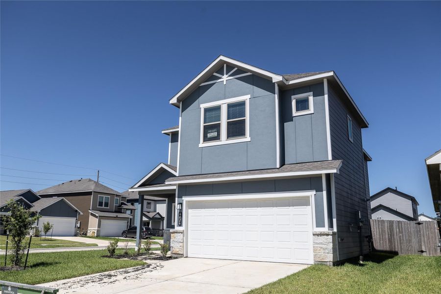 Front exterior of a new home in Glendale Lakes, Arcola, TX, highlighting curb appeal (Image 18). Front exterior of a new home in Glendale Lakes, Arcola, TX, highlighting curb appeal (Image 18).