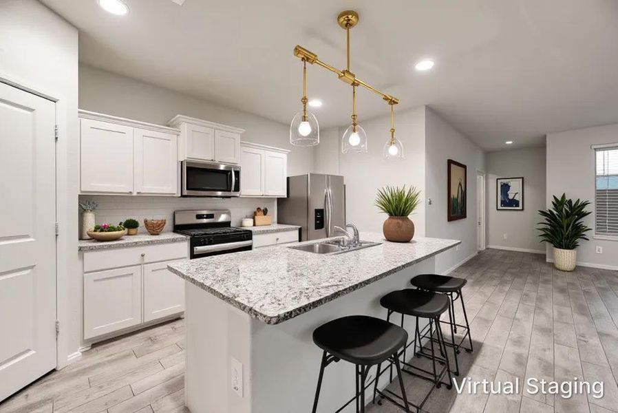 Contemporary kitchen featuring white cabinetry, stainless steel appliances, a white subway tile backsplash, and light-toned wood-finish flooring