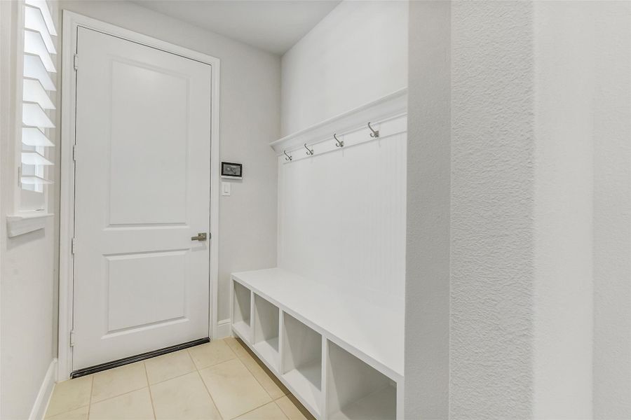 Entering from the garage is an ultra efficient Mud room with storage space and hooks for coats and hats. Entering from the garage is an ultra efficient Mud room with storage space and hooks for coats and hats.