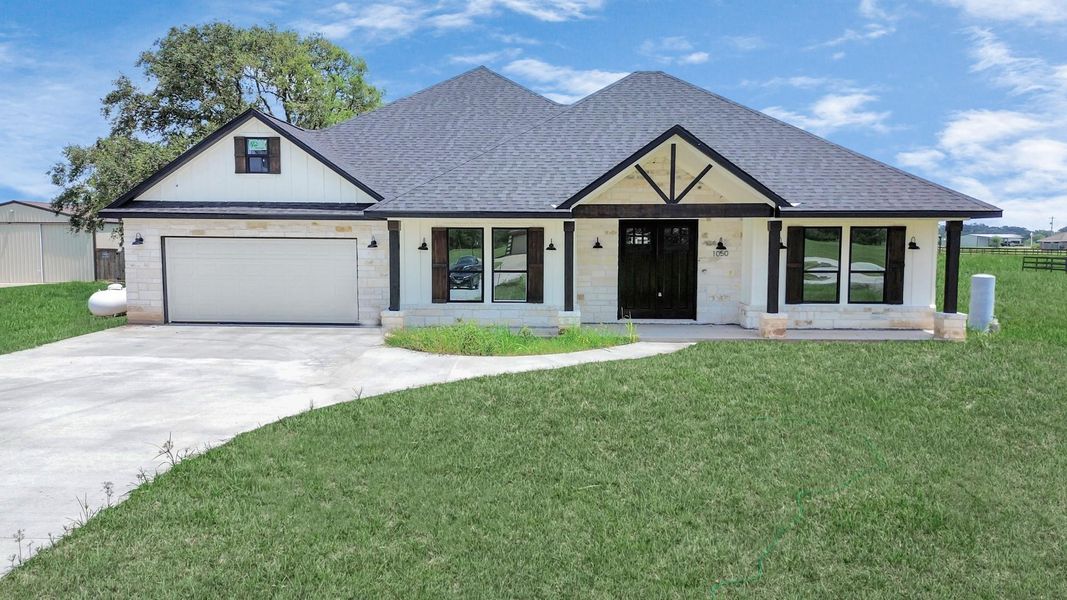 Front exterior of a new home in , Angleton, TX, highlighting curb appeal (Image 25).