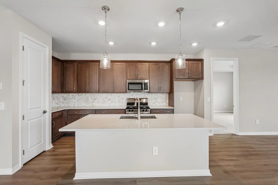 Spacious kitchen features our AW Collection® Roosevelt and a large island