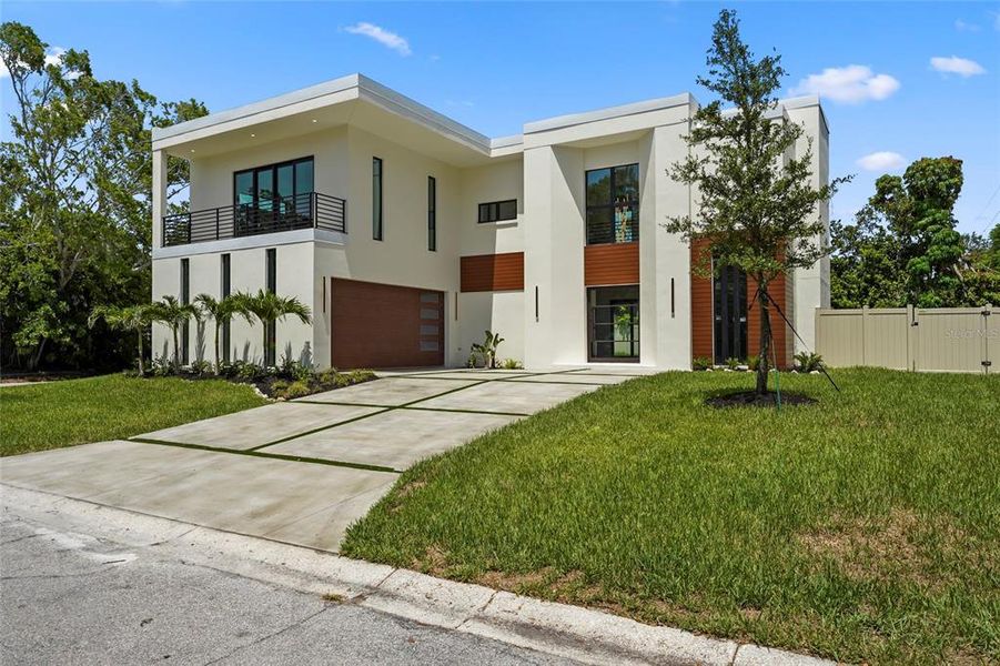 Front exterior of a new home in , Sarasota, FL, highlighting curb appeal (Image 30).