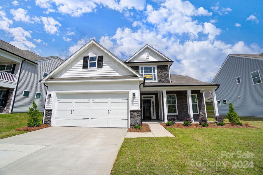 Homesite 14 features a Raleigh F floorplan