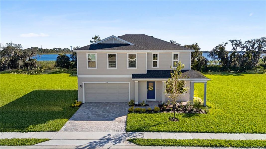 Front exterior of a new home in Willowbrook North, Winter Haven, FL, highlighting curb appeal (Image 23).