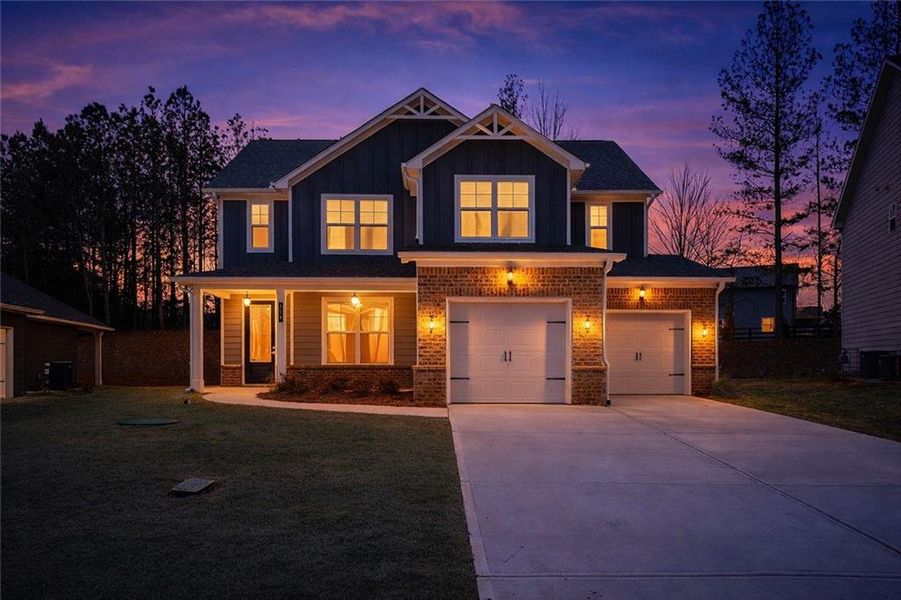 Front exterior of a new home in The Fairways at Mirror Lake, Villa Rica, GA, highlighting curb appeal (Image 25).